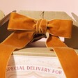 Close Up of Orange Bow on Personalised Special Delivery Christmas Gift Box 