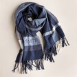 Personalised Embroidered Navy Striped Winter Scarf  twisted on plain surface