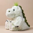 Warmies Marshmallow Green Dinosaur Soft Toy against neutral coloured background