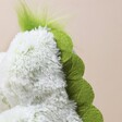 Close up of spine on Warmies Marshmallow Green Dinosaur Soft Toy