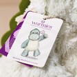 Close Up of tag on Warmies Marshmallow Green Dinosaur Soft Toy