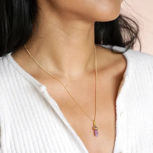 Close up of model wearing the Amethyst Crystal Point Pendant Necklace in Gold