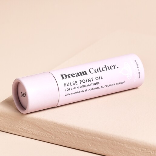 Packaging for the Aery Dream Catcher Pulse Point Roll On - on a Beige Background