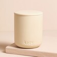 Aery Himalayan Cedarleaf Triple Wick Candle with closed lid on a neutral background