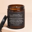 Aery Pepper Raspberry Tonka Indian Sandalwood Scented Jar Candle on a neutral background