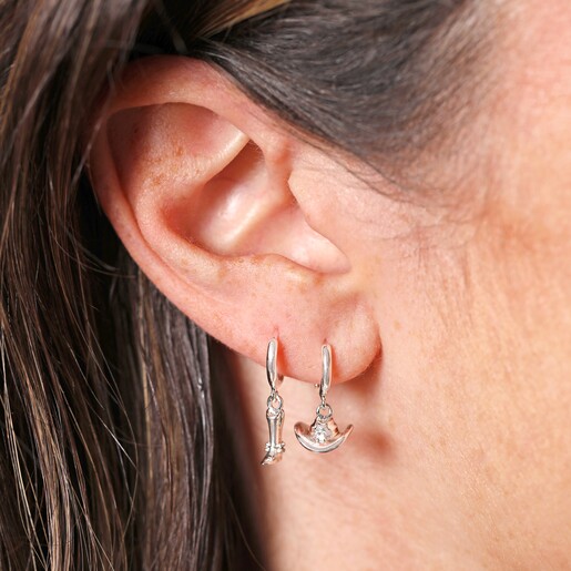 Close Up Model Shot Close Up Model Shot of Mismatched Cowboy Boot and Hat Huggie Hoop Earrings in Silver