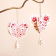 Hearts Folklore Hanging Decoration on a Beige Background 