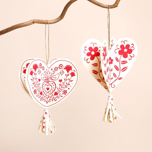 Hearts Folklore Hanging Decoration on a Beige Background 