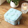 Close up Moonrise Square Linen Travel Jewellery Case in Blue on a Dressing Table