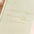 Close Up of Sage Green 2025 Diary 'twenty twenty five' lettering in gold swirling lettering