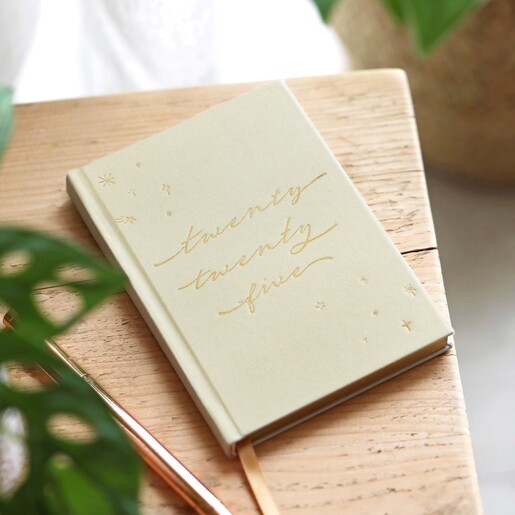 Sage Green 2025 Diary close on a wooden table
