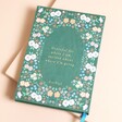 Green Floral Daily Gratitude Journal on beige background