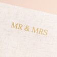 Close up of 'Mr & Mrs' in capital letters and gold foil