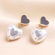 Vladislava Heart Pearl Drop Earrings in Gold on beige background