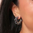 Close Up of London Marina Cluster Beaded Hoop Earrings in Gold on a model