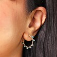 Close Up Model Shot of Big Metal London Svetla Beaded Hoop Earrings in Blue