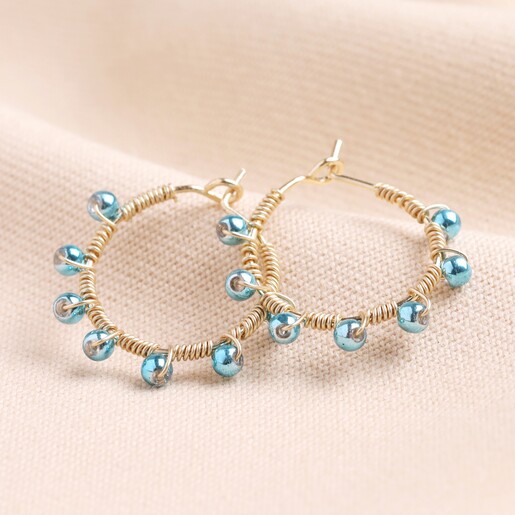 Svetla Beaded Hoop Earrings in Blue on a neutral background