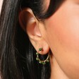 Close Up Model Shot of Big Metal London Svetla Beaded Hoop Earrings in Green