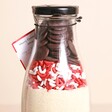 Close Up of Merry Gooey Chocolate Cookie Slab Mix with red and white sprinkles and chocolate buttons