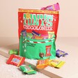 Tony's Chocolonely Rainbow Mix Christmas Pouch with a selection of chocolates shown