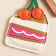 Close Up of Caroline Gardner Cake Slice Keyring