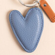 Caroline Gardner Blue Heart Keyring on a Beige Background