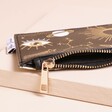 House of Disaster After Dark Black Zip Purse zip close up on neutral background