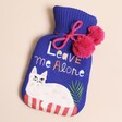 House of Disaster Catnip 'Leave Me Alone' Hot Water Bottle on a Beige Background