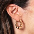 Model Shot for the Layla Large Dotted Hoop Earrings in Gold