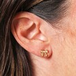 Close Up of Estella Bartlett Pearl Bow Stud Earrings