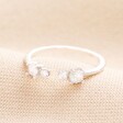 Adjustable Sterling Silver Crystal Ring on Neutral Fabric