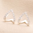 Sterling Silver Crystal Open Teardrop Earrings on Beige Background