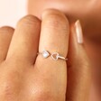 Model Wearing Adjustable Sterling Silver Double Heart Ring in Silver on Ring Finger