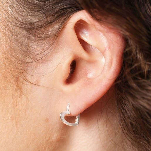 Close Up of Model Close Up of Sterling Silver Heart Outline Huggie Hoop Earrings on Model