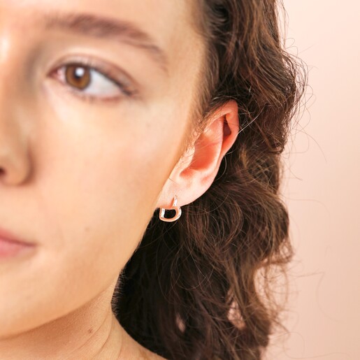 Model Shot Model Shot of Sterling Silver Heart Outline Huggie Hoop Earrings