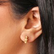 Model Shot of Sterling Silver Pearl Flower Huggie Hoop Earrings in Gold