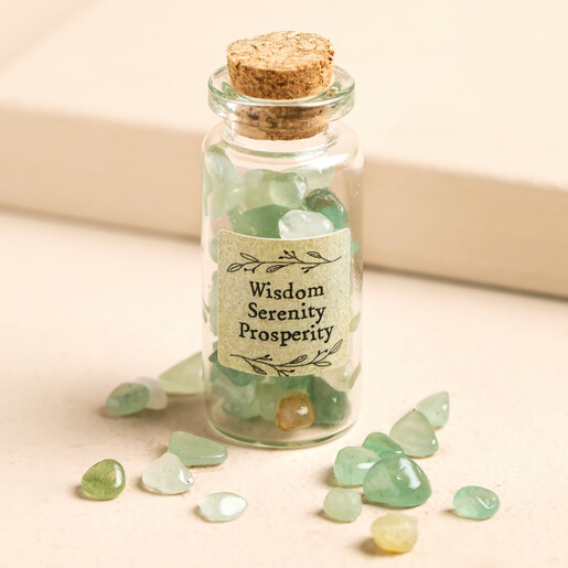 East of India Bottle of Green Aventurine Crystals on Neutral Background East of India Bottle of Green Aventurine Crystals