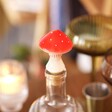 Toadstool Cork Bottle Stopper in use on a bottle