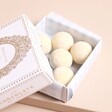 Close Up of White Chocolate Champagne Truffles Inside Box