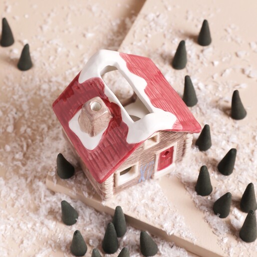 Top view of the Paddywax Alpine Chalet Incense & Tealight Holder with red roof and door
