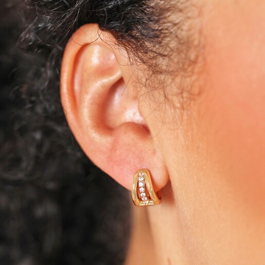 Close Up of Model Close Up of Triple Illusion Crystal Huggie Hoop Earrings in Gold on Model