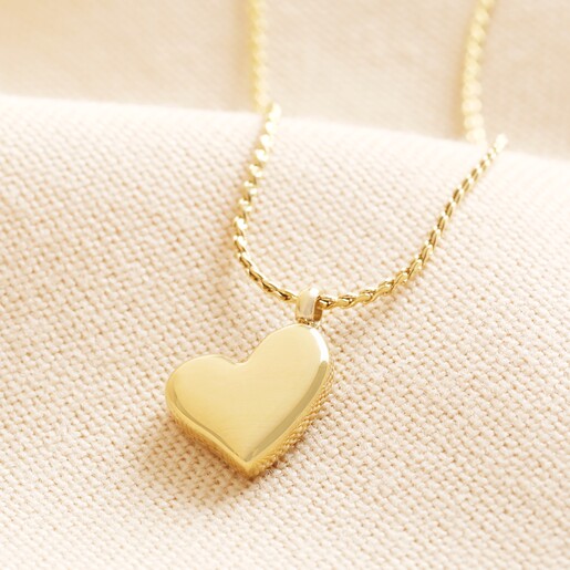 Gold Puffed Heart Pendant Necklace A chunky heart pendant necklace in gold.