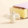 Close Up of Tiny Matchbox Ceramic Angel Token