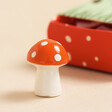 Close Up of Tiny Matchbox Ceramic Mushroom Token