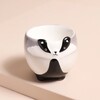 Ceramic Badger Egg Cup against beige background