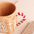 Close Up of Gingerbread House Ceramic Mug with Lid