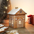 A house shaped wax melt burner designed to look like a gingerbread house