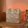 Mini Rustic House Tealight Holder on a warm winter backdrop