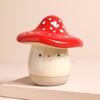 Toadstool Money Box on a Beige Background