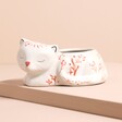 Pink and White Floral Sleeping Cat Planter on a beige background